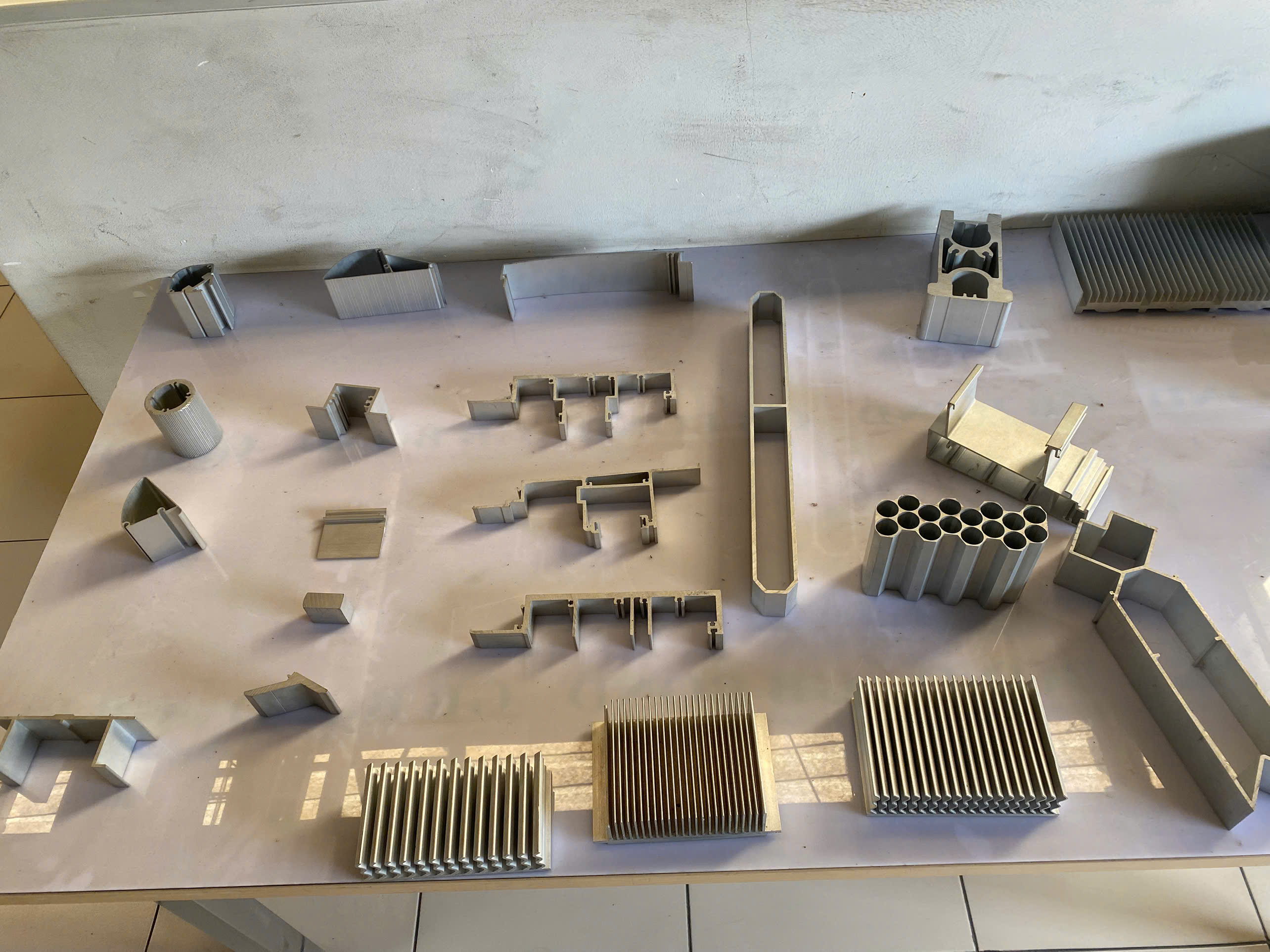 Custom aluminum extrusion profiles showing various cross-section designs